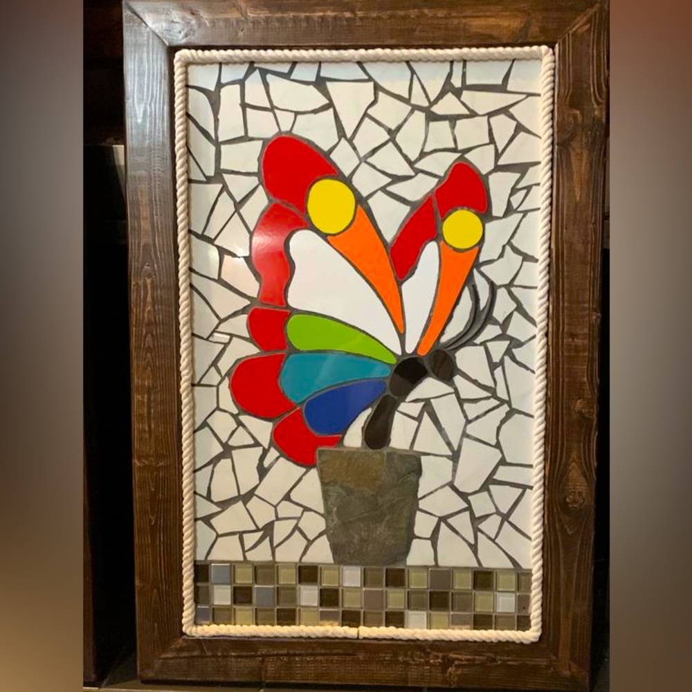 Butterfly mosaic painting carefully handcrafted with colorful mosaic tiles.